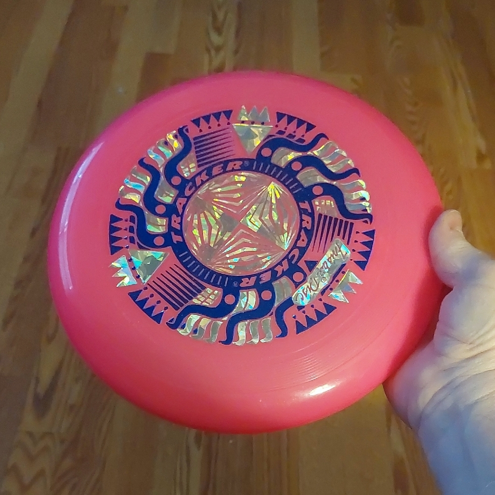 Vintage WHAM-O Pink Tracker Frisbee with Prysmatic Sun Design